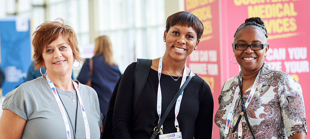 three women conference attendees