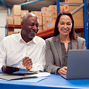 supply managers working on laptop