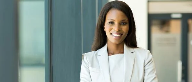 professional woman smiling in business suit