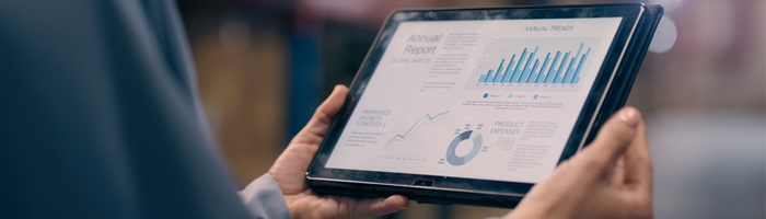 person holding a tablet in a warehouse